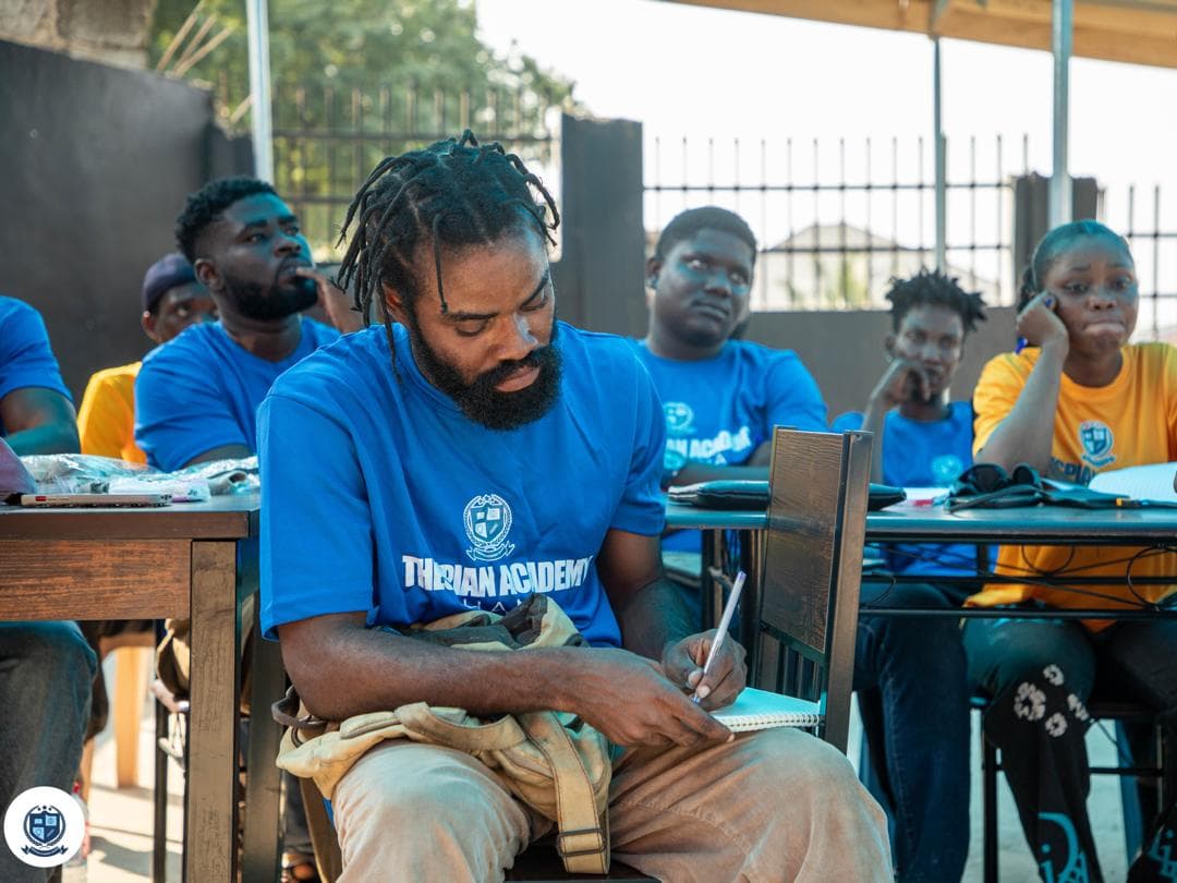 A student taking notes during a practical session